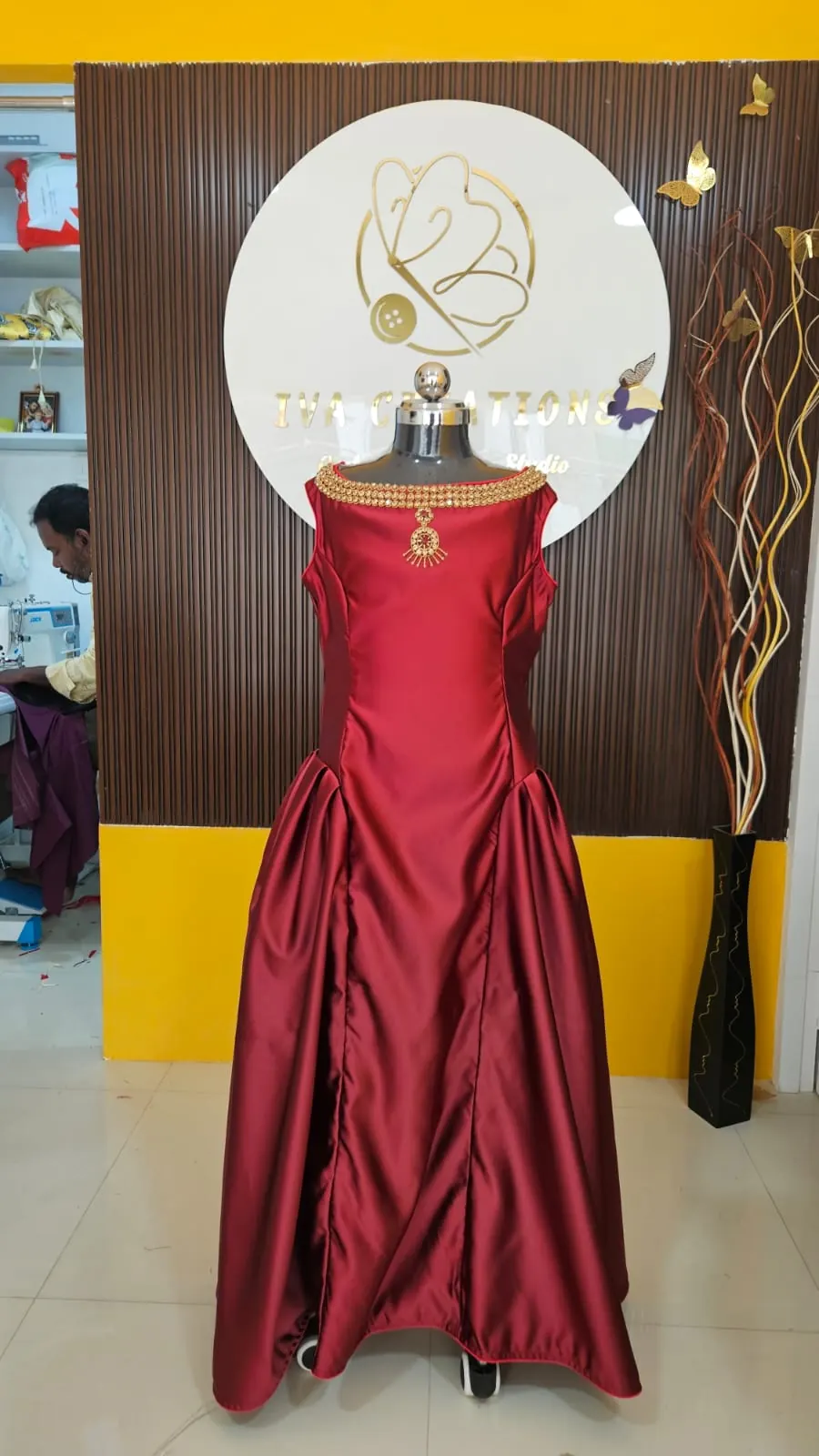 Maroon satin gown with jewelled neckline
